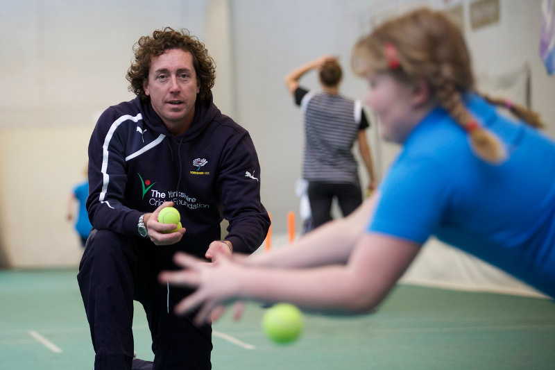 girl does catching practice with Ryan Sidebottom 