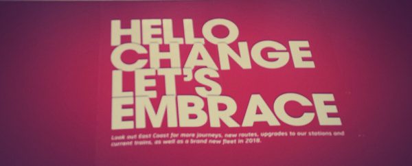 Hello Change let's embrace sign at leeds railway station