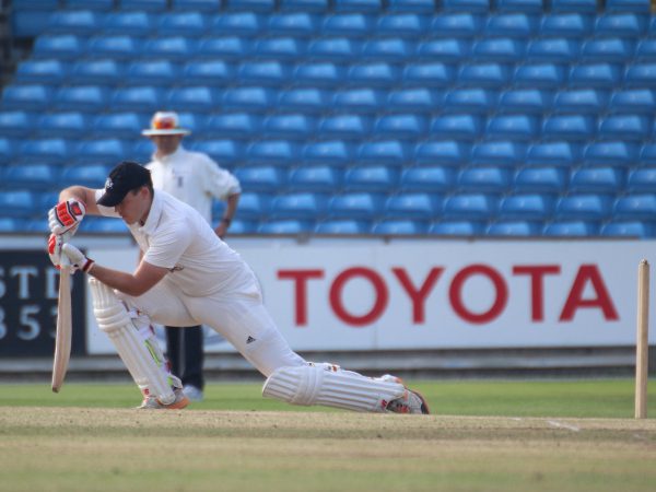 chris allinson batting for great ayton, stretches into a forward defensive.