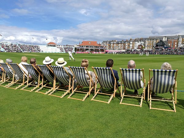 fans sit in deckchairs at scarborough cricket club