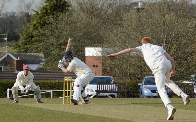 leeds and wetherby cricket league action as a batsman gets ready to drive a ball.